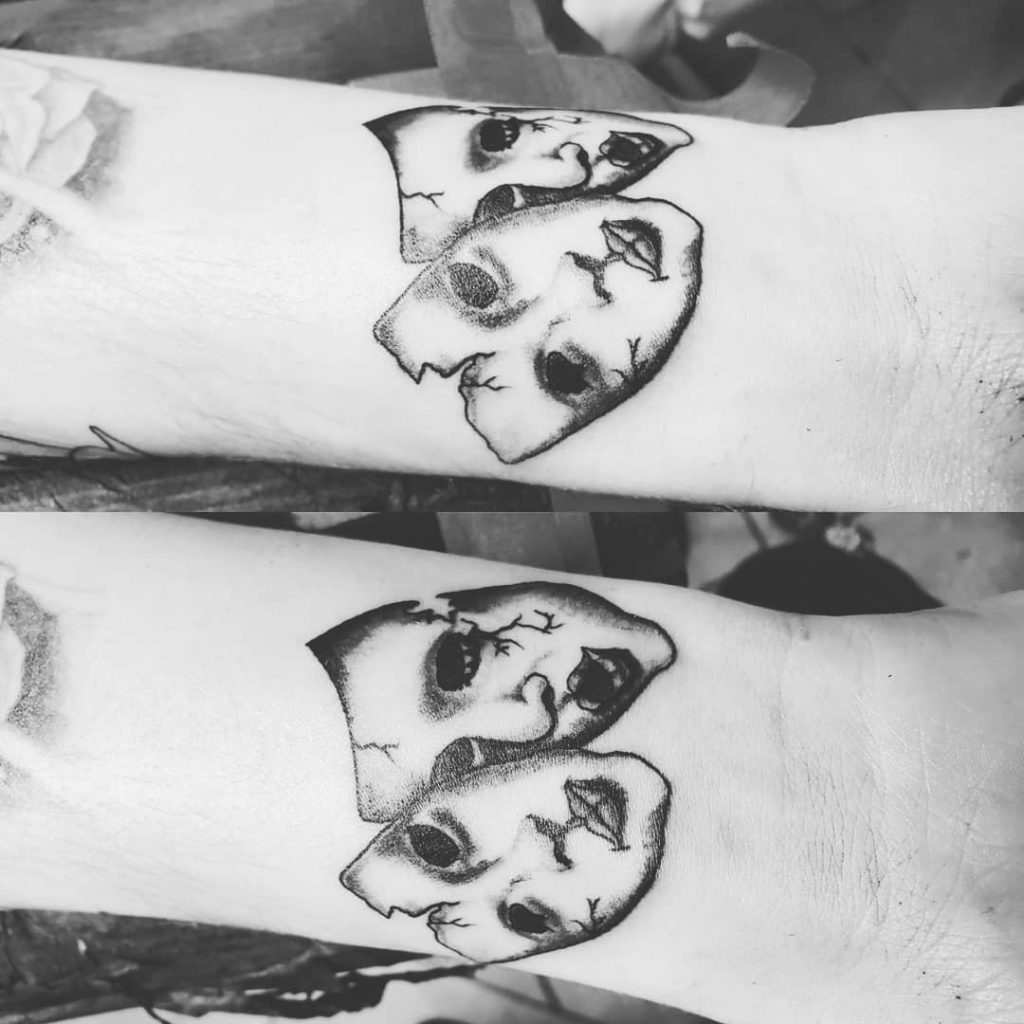 Theater masks tattoo