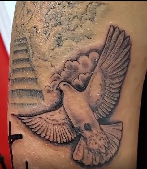 Realistic dove tattoo