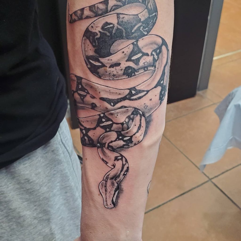 Realistic boa constrictor snake tattoo